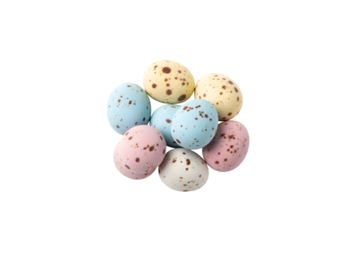 Small, multicolored chocolate eggs with speckles, set against a white background in a close-up shot. Top view
