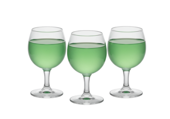 Isolated glasses of green liquid drink containing mint liqueur or absinthe beverage drink