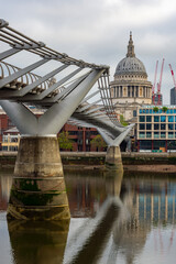 St. Paul's cathedral and Millennium bridge over Thames river, London, UK