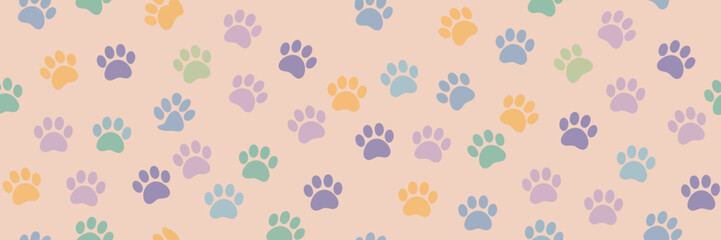 Adorable colorful paw prints pattern on soft peach background