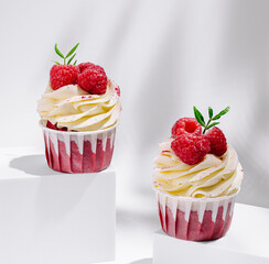 Delicious raspberry cupcakes with creamy frosting on display