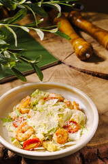 Delicious shrimp salad served on a rustic wooden table