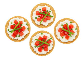 Isolated appetizer crackers with cream cheese, diced tomatoes, and chives delicious snacks