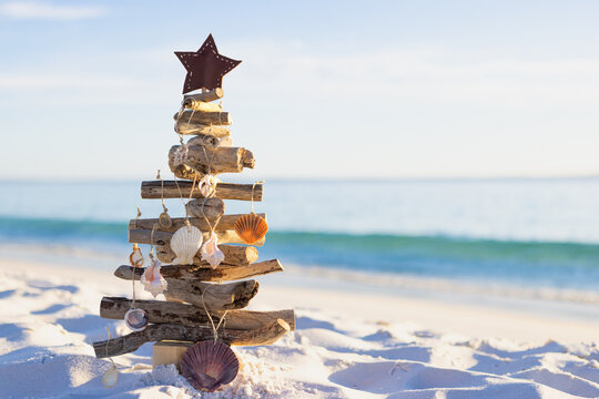 Summer holiday Christmas Tree on beach - Powered by Adobe