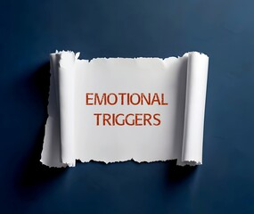 Torn paper written Emotional Triggers - result in intense, emotional and physical reactions caused by pain, trauma or stress