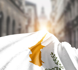 Cyprus flag fluttering on blur street with building. Cyprus national flag for independence day.