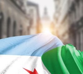 Djibouti flag fluttering on blur street with building. Djibouti national flag for independence day.