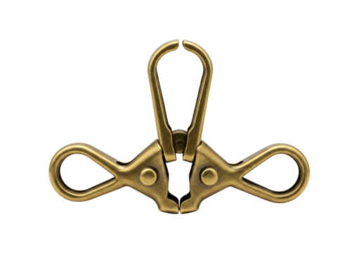 Isolated vintage brass metal clip fastener for DIY craft and handmade accessories project