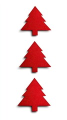 Obraz premium Red paper decorations shaped like Christmas trees are arranged in a vertical line on a plain white background. This festive display is perfect for holiday crafts and celebrations