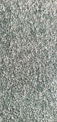 Fluffy carpet texture background. Soft rug for a bathroom or bedroom. Beige or gray fluffy carpet texture. Home interior decor. Terry rug.