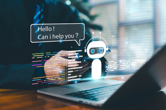 A professional interacting with a virtual AI chatbot displayed above a laptop, symbolizing artificial intelligence assistance, automated communication, digital support systems, smart conversational