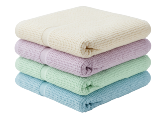 Isolated stack of waffle textured hand towels in pastel colors folded for storage or sale