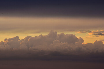 Brilliant evening sky painted with magical sunset tones across clouds