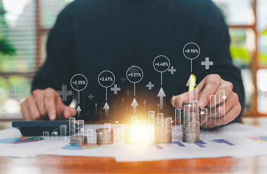 A professional calculating financial growth with stacked coins, charts, and virtual percentage indicators, symbolizing investment performance, money management, savings growth, and long-term financial