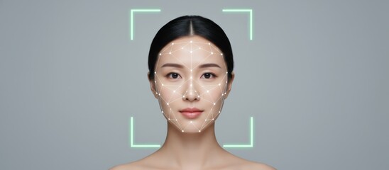 Asian woman's face being scanned with a digital grid and glowing frame, representing biometric technology, artificial intelligence, and secure authentication