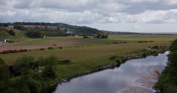 Extra wide shot looking down on the river north Esk and the sea beyond
