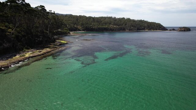 Turquoise Sea Surrounding Tasman National Park In Australia - Drone Forward