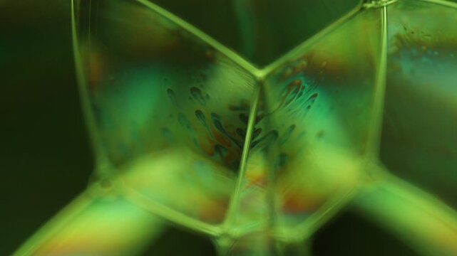 Green liquid surface, phenomenal structure, green oils on a geometric background, colourful luminous abstract, surrealistic art, glowing effects