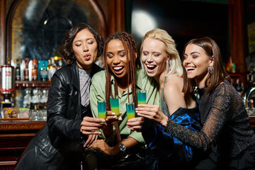 Friends celebrate joyously with vibrant shots, creating unforgettable memories at a lively party