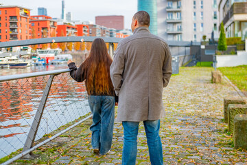Fototapeta premium Sad moment between young couple, serious argument or disagreement between male and female partner, emotional tension, breakup urban scene, painful moment conflict, Dramatic relationship, European city