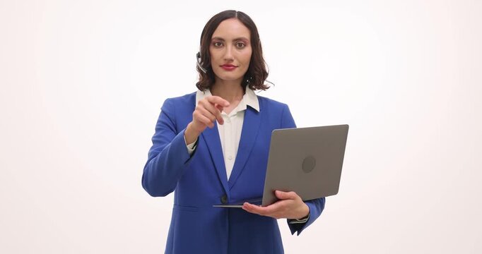 Woman holds laptop pointing forward to request attention. Young expert shows call gesture inviting client to phone for giving details slow motion