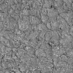 A concrete wall covered with paint with a texture of defects and cracks