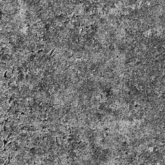 A concrete wall covered with paint with a texture of defects and cracks