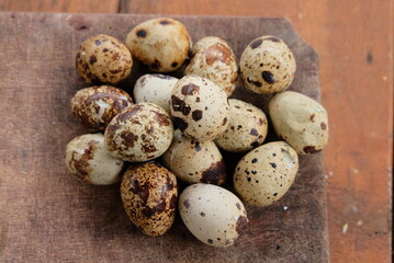 cooked quail eggs on wooden background