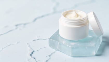 Moisturizer in a white jar on a light blue background with copy space