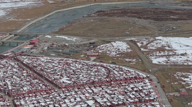 Aerial Pan Over Yaqing Monastery and Tibetan Buddhist Settlement in Winter