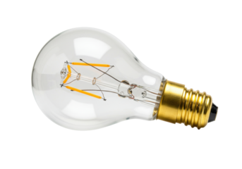 Isolated warm clear Edison light bulb emitting energy with metal base and filament wire