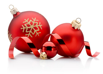 Three red Christmas decoration baubles and curling paper ribbon isolated on white background