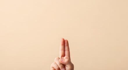 Child hand, Fingers crossed on plain background for luck, hope, expectation,