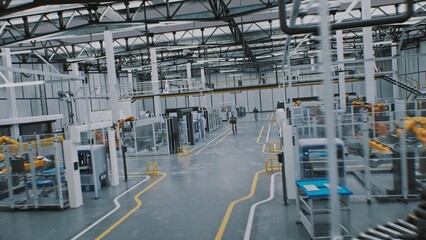 Fototapeta premium Clean Industrial Environment With Zero Human Presence. Futuristic Factory Environment Where Machinery and Robotics Handle All Assembly. Concept Next Generation Production and Absence of Manual Labor.