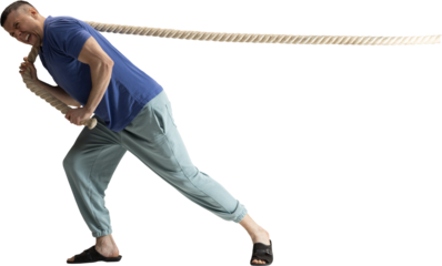 Man pulling rope around shoulders with strained determined emotion on transparent background. Concept of pressure, resistance, effort, corporate struggle and strong motivational storytelling.