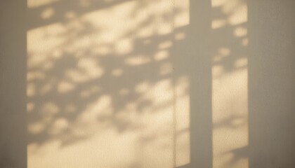 Soft-focus warm shadow patterns on a beige wall