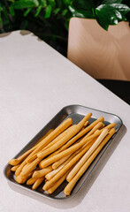 Savory snack sticks on a silver tray ready to be served
