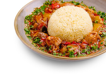 Delicious rice with savory stew and fresh herbs on a stylish plate