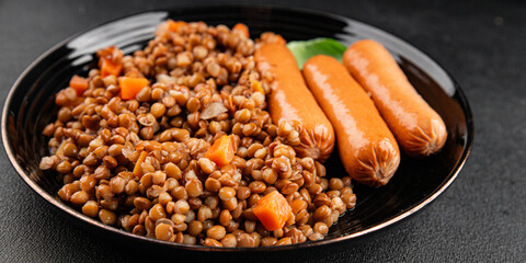 Lentils with sausage second course quick meal natural tasty appetizer fresh delicious gourmet food background on the table rustic top view copy space