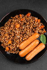 Lentils with sausage second course quick meal natural tasty appetizer fresh delicious gourmet food background on the table rustic top view copy space