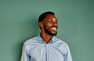Portrait of a young happy businessman having a meeting or training in the office. Teamwork and success concept, portrait of a smart young businessman, student, teacher or coach
