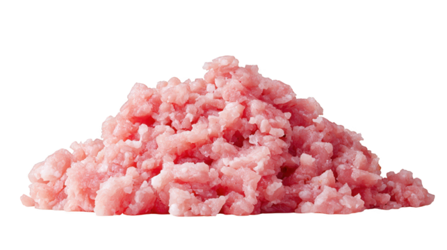 Pile of chopped pink meat rests on black surface freshly cut pink meat shown in heap on dark setting
