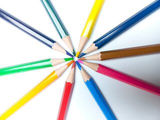 Colored pencils placed on a white background