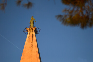Obraz premium Bell Tower of St. Euphemia church with bronze statute on the top