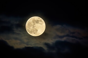 Close-up of a full moon with professional color grading and soft shadows, perfect for educational, scientific, and artistic applications in low contrast settings.
