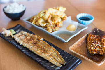 Japanese grilled eel served over rice on plate