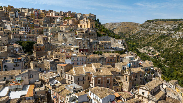 Aerial view of the roofs, houses and apartments, ideal for the concept of an Italian hilltop village nestled among the mountains. This is the historic center of Ragusa Ibla, Sicily, Italy.