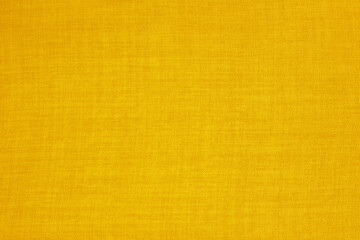 Yellow gold linen fabric cloth texture for background, natural textile pattern.