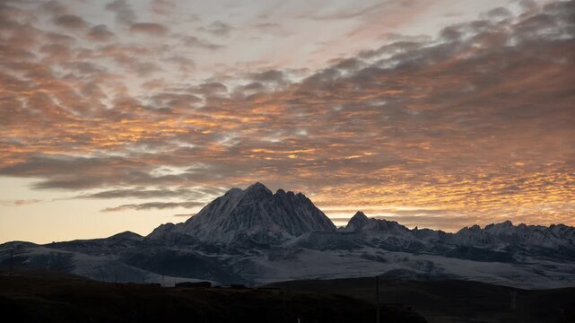 Sunrise time lapse of Yala Snow Mountain in Sichuan