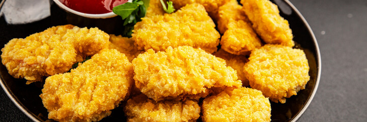 Chicken nuggets fast food natural tasty appetizer fresh delicious gourmet food background on the table rustic top view copy space